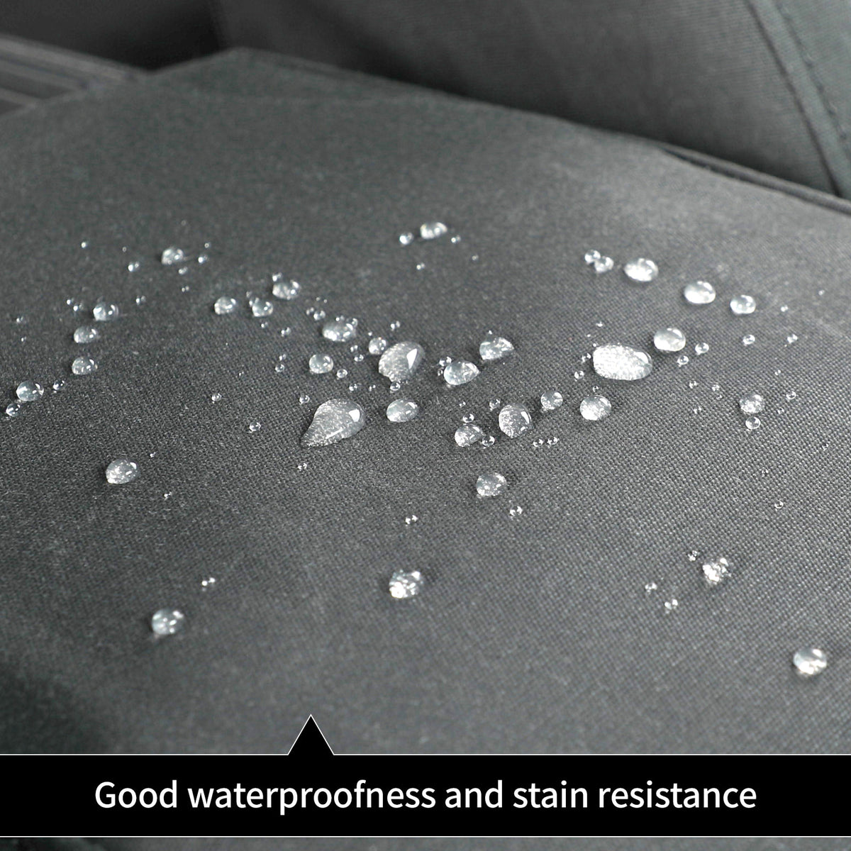 Close-up of a dark gray textured fabric surface with scattered clear water droplets and the text 'Good waterproofness and stain resistance' at the bottom.