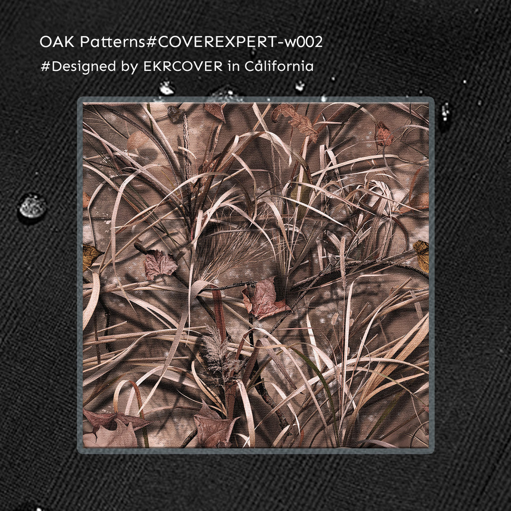 A square camouflage pattern sample showing dry grass and leaves in earthy brown, beige, and gray tones, centered on a dark textured background 