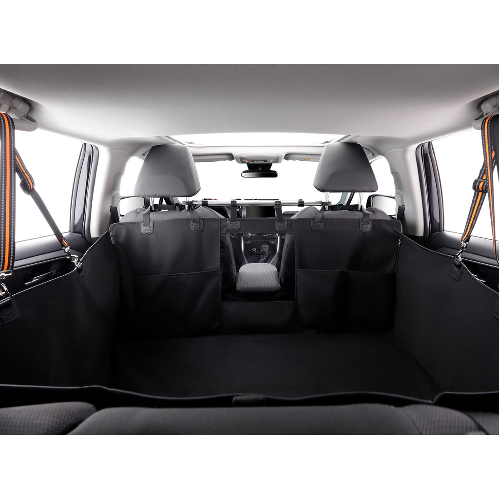 Black cargo liner and seat covers installed in the trunk of a vehicle, with the rear seats folded down to show the installed fit.