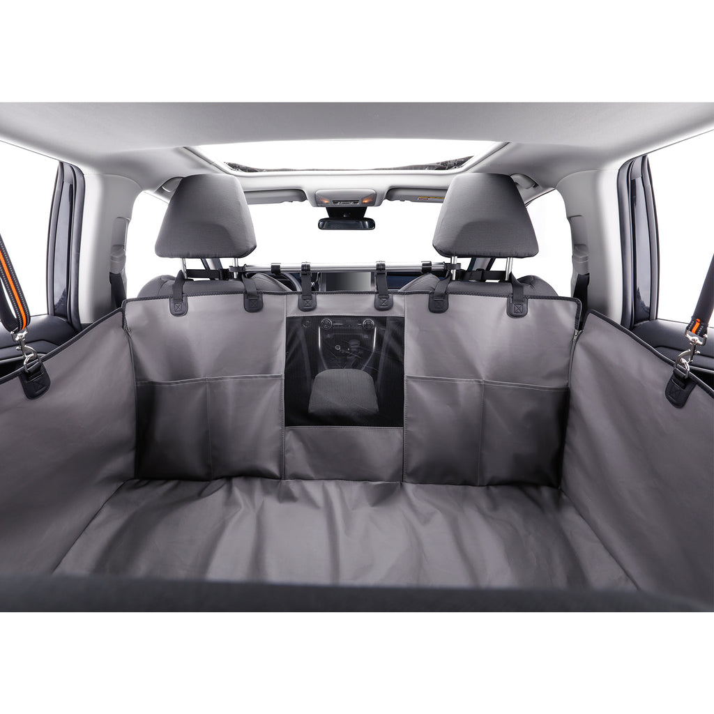 A dark gray car cargo liner installed across the back seat area of a vehicle, with a front cargo organizer pocket in the center, shown from the rear of the car.