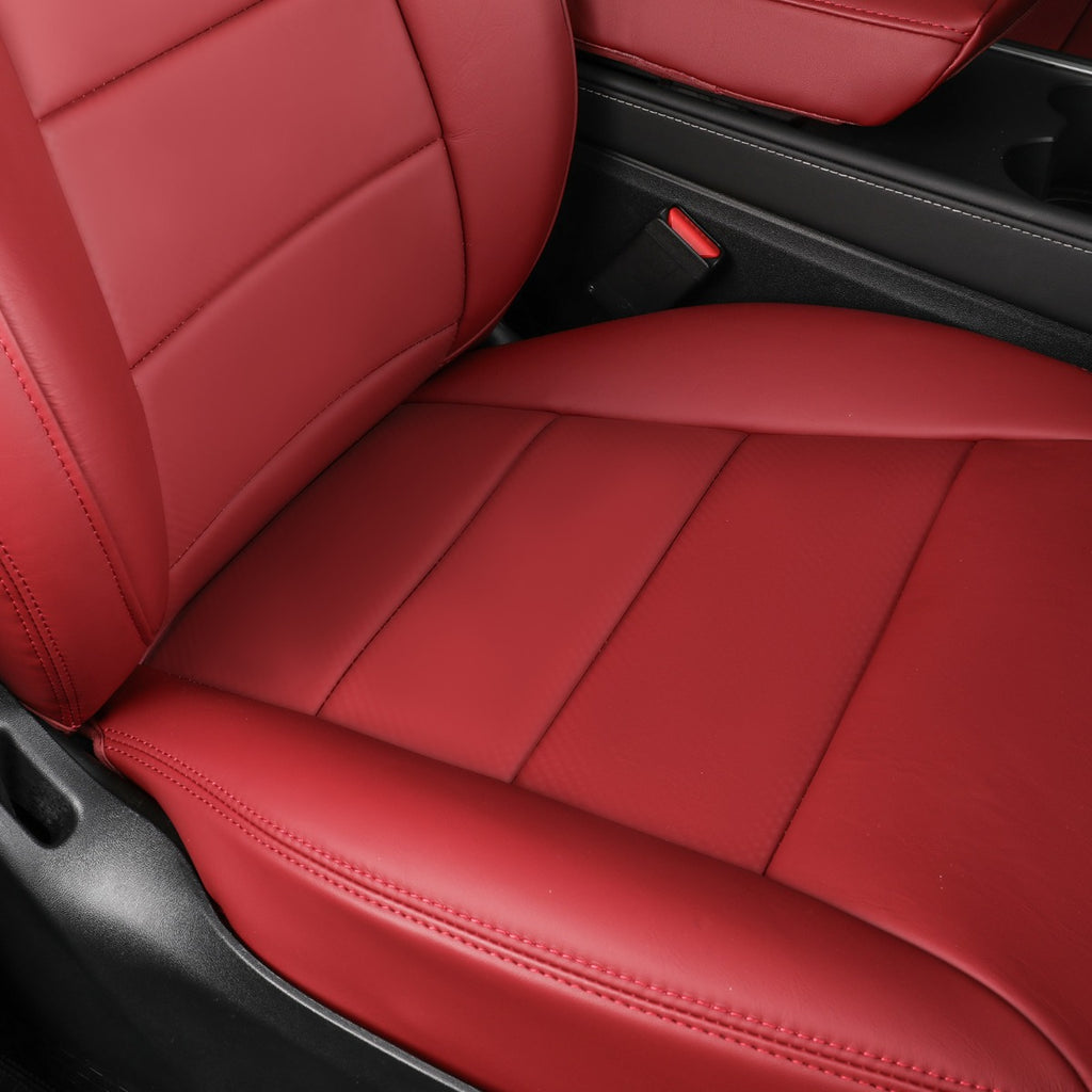 A close-up of a car seat cover in burgundy leather, showing the seat back, cushion, and side panel with contrast stitching, installed inside a vehicle.