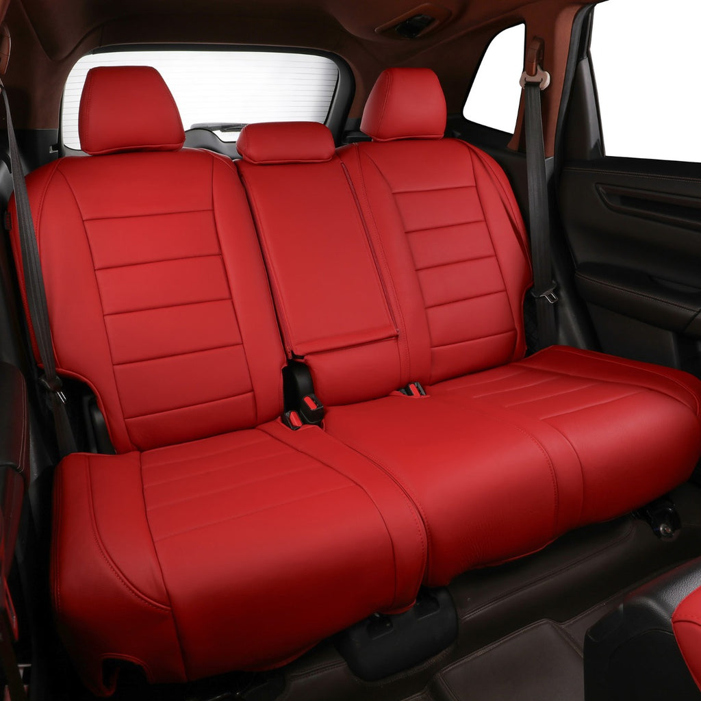 Red car seat covers installed on a three-seat vehicle rear bench, shown inside a dark car interior.