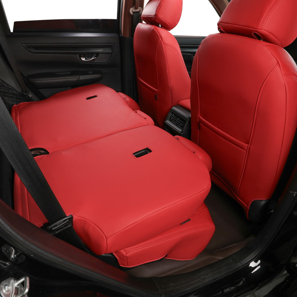 Red car seat covers installed on the front and rear seats of a vehicle interior, shown from an open door view.