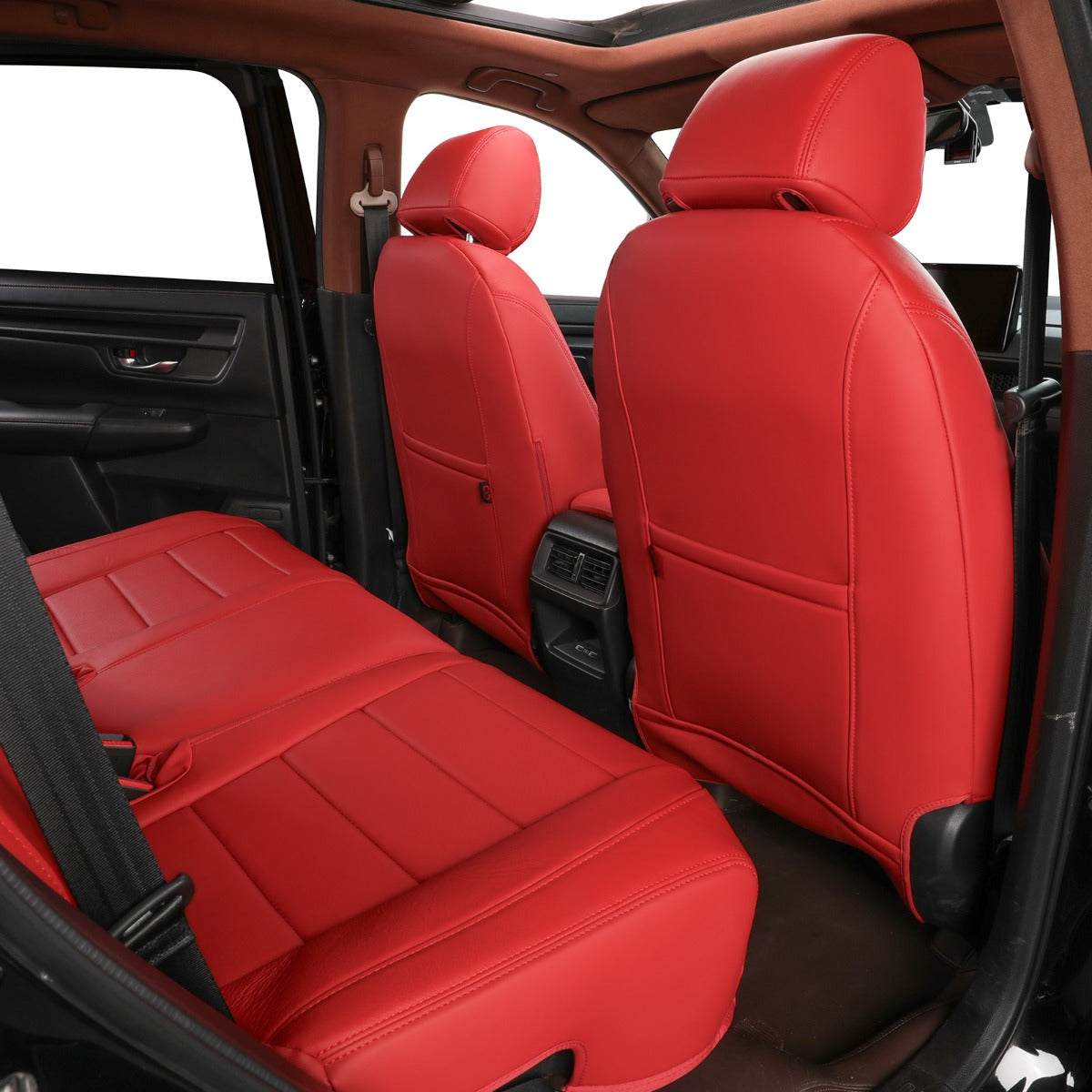 Bright red car seat covers installed on the front and rear seats of a vehicle interior, shown from an open door view.