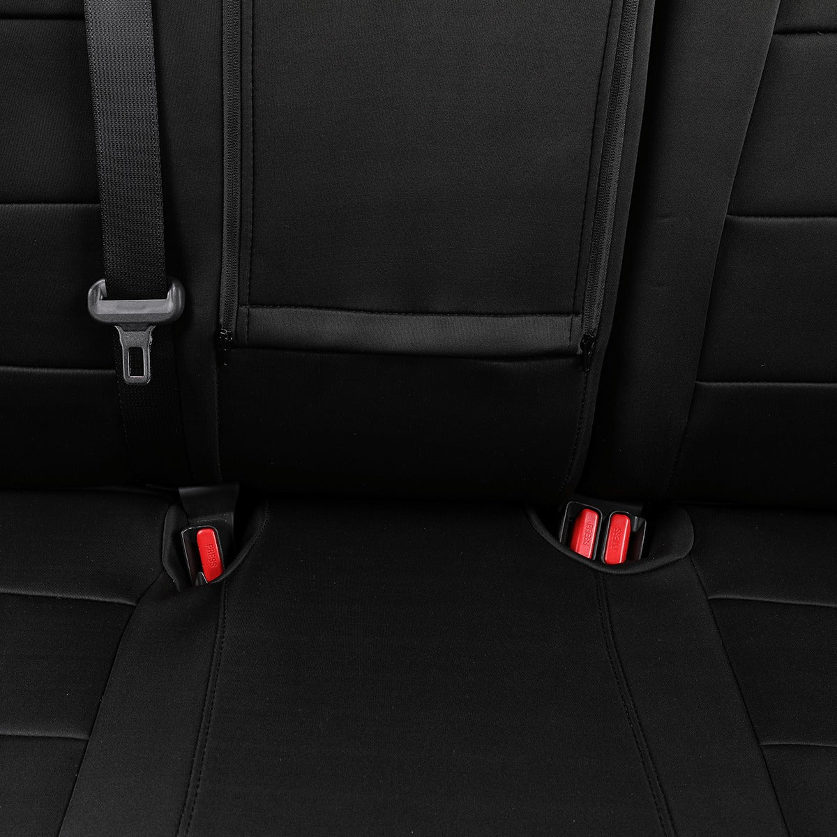 Black car seat cover installed on a vehicle's rear seat, featuring a zippered storage pocket on the backrest and seat belt hardware visible on the left.