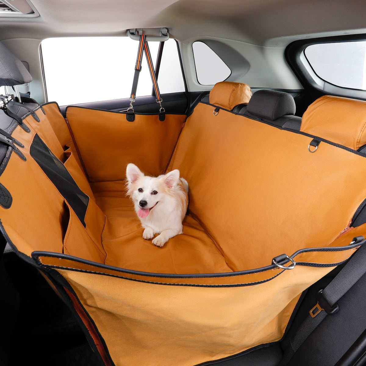 Dog sitting on an brown car seat cover in a vehicle
