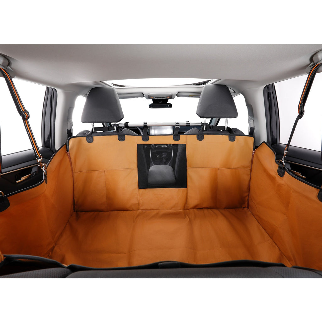 An brown cargo liner set installed inside a vehicle trunk, shown behind the front seats with a central black mesh window panel.